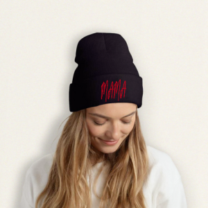 Black knit beanie with a red “MAMA” print, worn by a woman as a Mother’s Day gift.