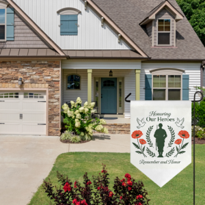 Patriotic Memorial Day garden flag with soldier and poppy design, shown in a front yard to honor fallen heroes.