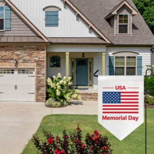 Patriotic Memorial Day garden flag with USA flag print, shown in a front yard to honor fallen heroes.