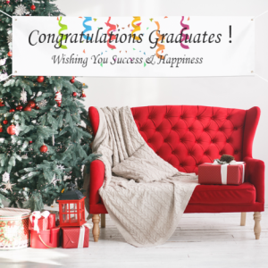 Graduation party banner displayed indoors, with "Congratulations Graduates!" text and confetti design, hung in a festive setting.