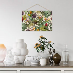 Custom tropical floral print hanging sign, displayed on a white wall above a console table, adding vibrant decor to a minimalist living space.
