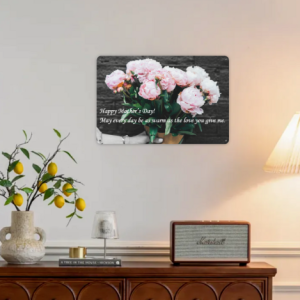 Mother’s Day themed metal tin sign with pink peonies and the quote “Happy Mother’s Day! May every day be as warm as the love you give me.”, displayed on a living room wall.
