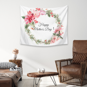 Custom Mother’s Day tapestry with a pink peony wreath print and “Happy Mother’s Day!” text, displayed as wall decor in a bohemian-style living room.