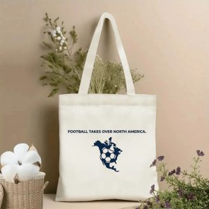 2026 World Cup North America Map Tote Bag, "Football Takes Over North America" graphic, beige polyester tote bag displayed with cotton branches and dried flowers, minimalist soccer fan accessory