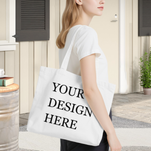 Woman carrying a white canvas tote bag with a pink heart print and "YOUR DESIGN HERE" text.