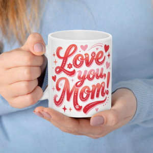 A white 11oz ceramic coffee mug held in hands, featuring "Love you, Mom!" in vibrant red-to-pink gradient cursive text surrounded by hearts, flowers, and sparkles.