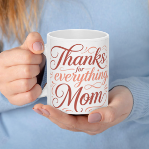 A white 11oz ceramic coffee mug held in hands, featuring "Thanks for everything, Mom" in warm red-to-pink gradient cursive text with decorative swirl accents.