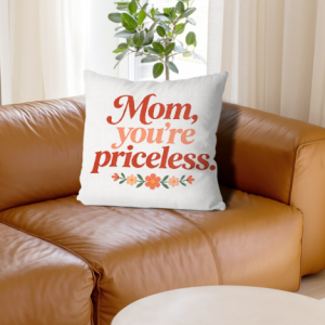White linen throw pillow cover with "Mom, you're priceless" print, coral gradient cursive lettering with small floral accents, home decor for Mother’s Day