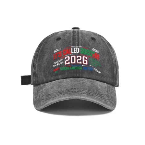 Dark gray vintage washed cotton adjustable dad hat, front bold red‑green‑blue “It’s Called Soccer! 2026 North America United” typography print with stacked soccer‑fan slogans, retro faded finish, casual sports baseball cap flat lay