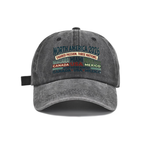 Dark gray vintage washed cotton adjustable dad hat, front retro multi‑color stacked‑text print featuring North America 2026 host nations & cities slogan, faded vintage finish, casual sports baseball cap flat lay