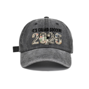 Dark grey vintage washed adjustable dad hat with retro newspaper‑collage 2026 number print and bold “It’s Called Soccer!” slogan, North America 2026 World Cup casual soccer fan baseball cap