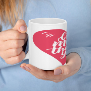 A white 11oz ceramic coffee mug held in hands, featuring a large red heart with white cursive text reading "best mom thank you".