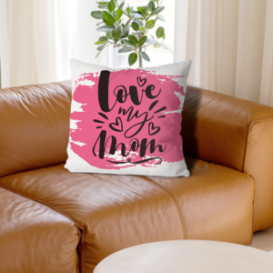White linen throw pillow cover with "love my mom" print, black cursive lettering on pink brushstroke background, home decor for Mother’s Day