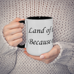Memorial Day quote mug held in hands, showcasing the black handle and white body with "Land of the Free, Because of the Brave" print.