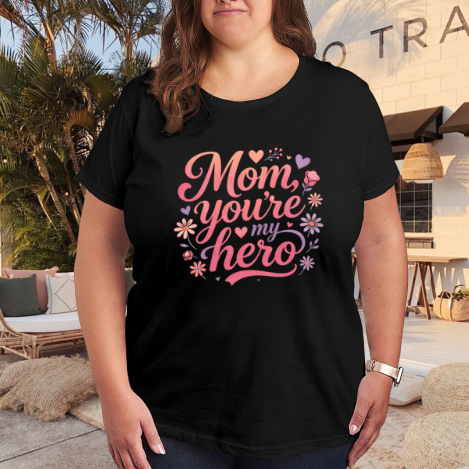 Plus size black women’s t-shirt with "Mom, you're my hero" floral print, casual crewneck tee styled for outdoor patio wear