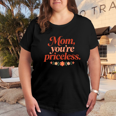 Plus size black women’s t-shirt with "Mom, you're priceless" floral-accented print, casual crewneck tee styled for outdoor patio wear