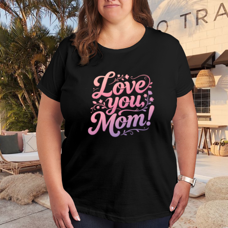 Plus size black women’s t-shirt with "Love you, Mom!" floral-accented gradient print, casual crewneck tee styled for outdoor patio wear