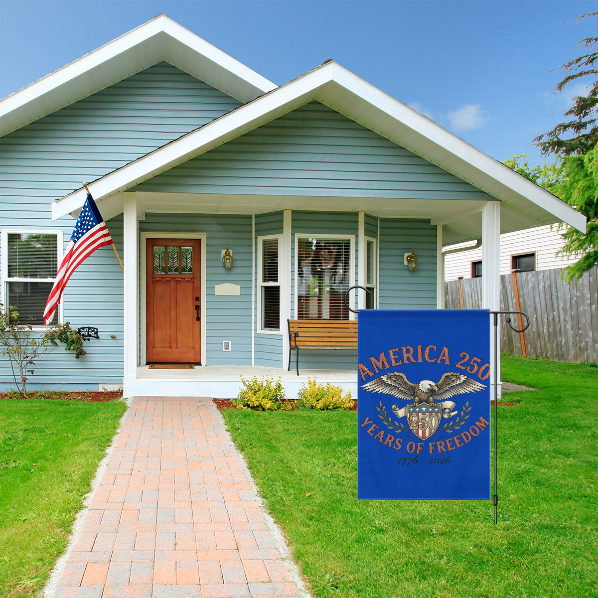 "America 250 Years of Freedom" garden flag displayed in a front yard, adding a festive touch to a home’s exterior for anniversary celebrations.