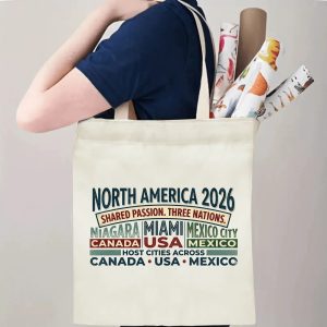 Tote bag being carried over the shoulder, showing the print from the side view with rolled-up items inside, demonstrating everyday use.