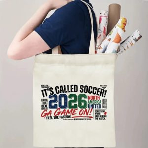 Tote bag being carried over the shoulder, showing the print from the side view with rolled-up items inside, demonstrating everyday use.