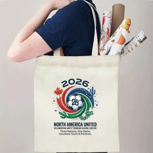 Tote bag being carried over the shoulder, showing the print from the side view, demonstrating everyday use.
