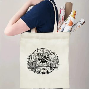 A person carrying the tote bag, showing its size and how the print appears when worn.