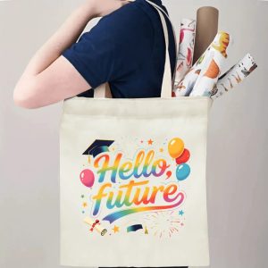 Person carrying natural canvas graduation tote bag with rainbow‑gradient "Hello, future" celebratory print, graduation cap and balloon graphics, casual milestone‑celebrating reusable gift bag