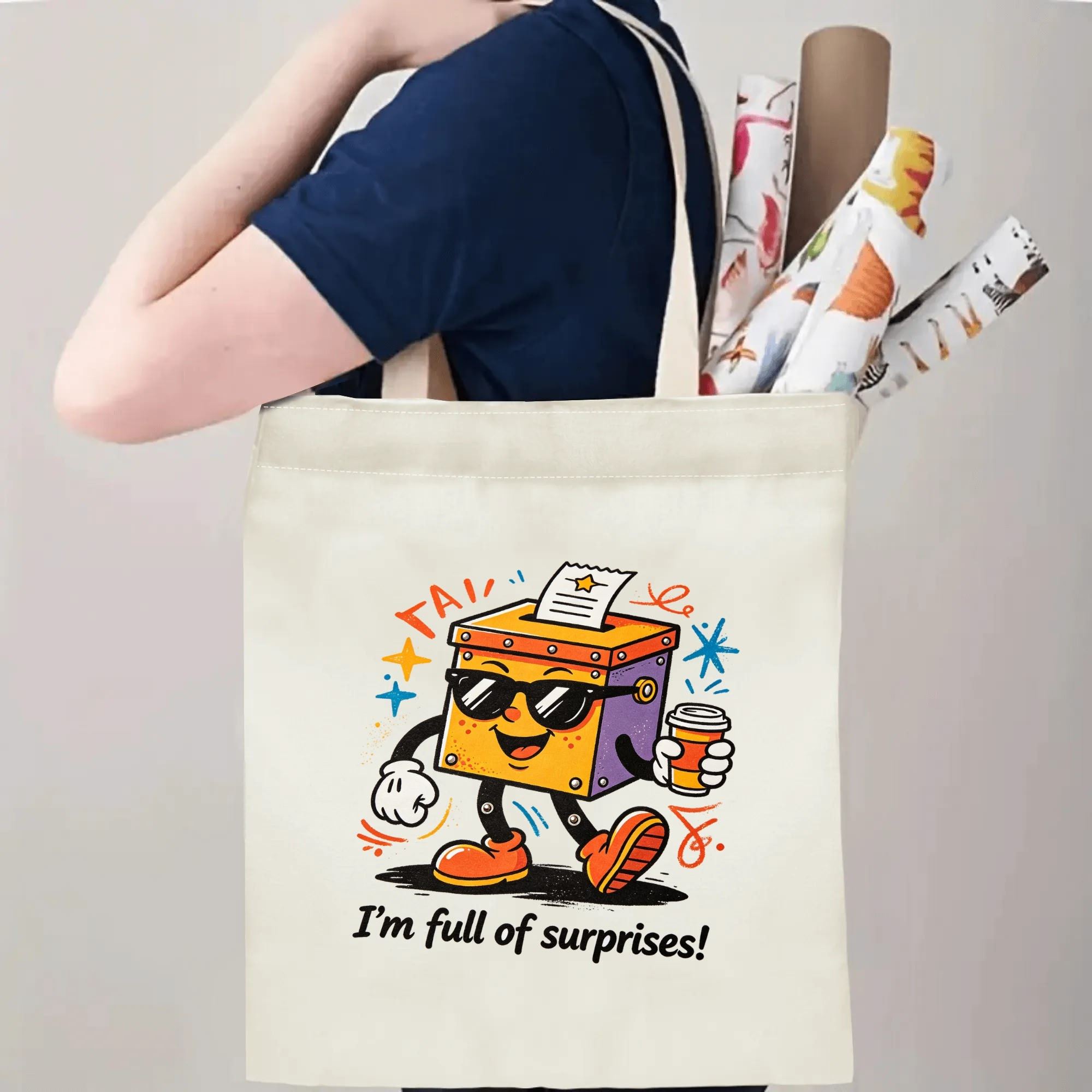 Person carrying natural canvas quirky cartoon‑print tote bag with cool ballot box character and "I'm full of surprises!" slogan, fun casual reusable gift bag for everyday