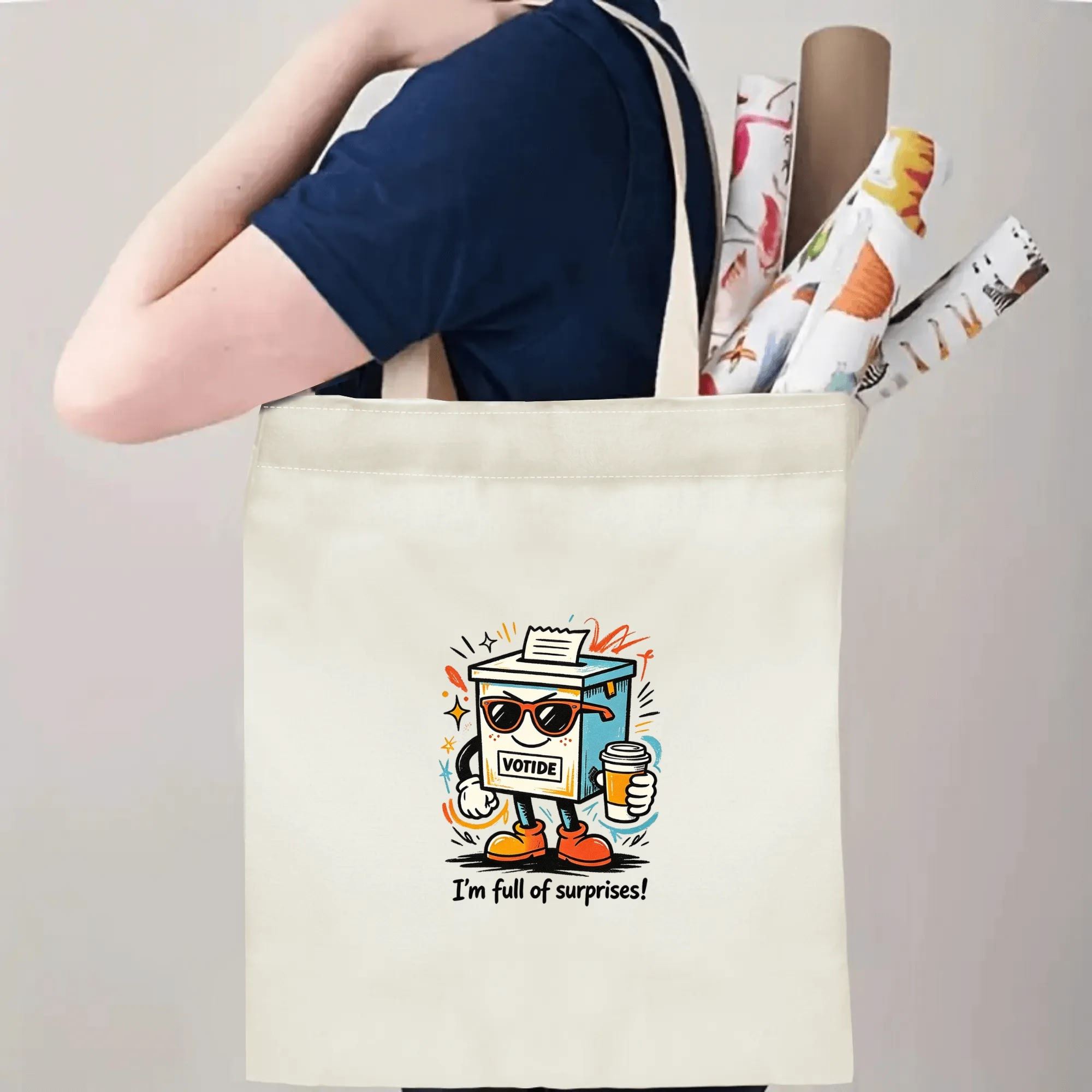 Person carrying natural canvas 2026 mid‑term election gag gift tote bag with fun cartoon ballot box print and "I'm full of surprises!" humorous slogan, reusable political accessory for election rallies and everyday errands
