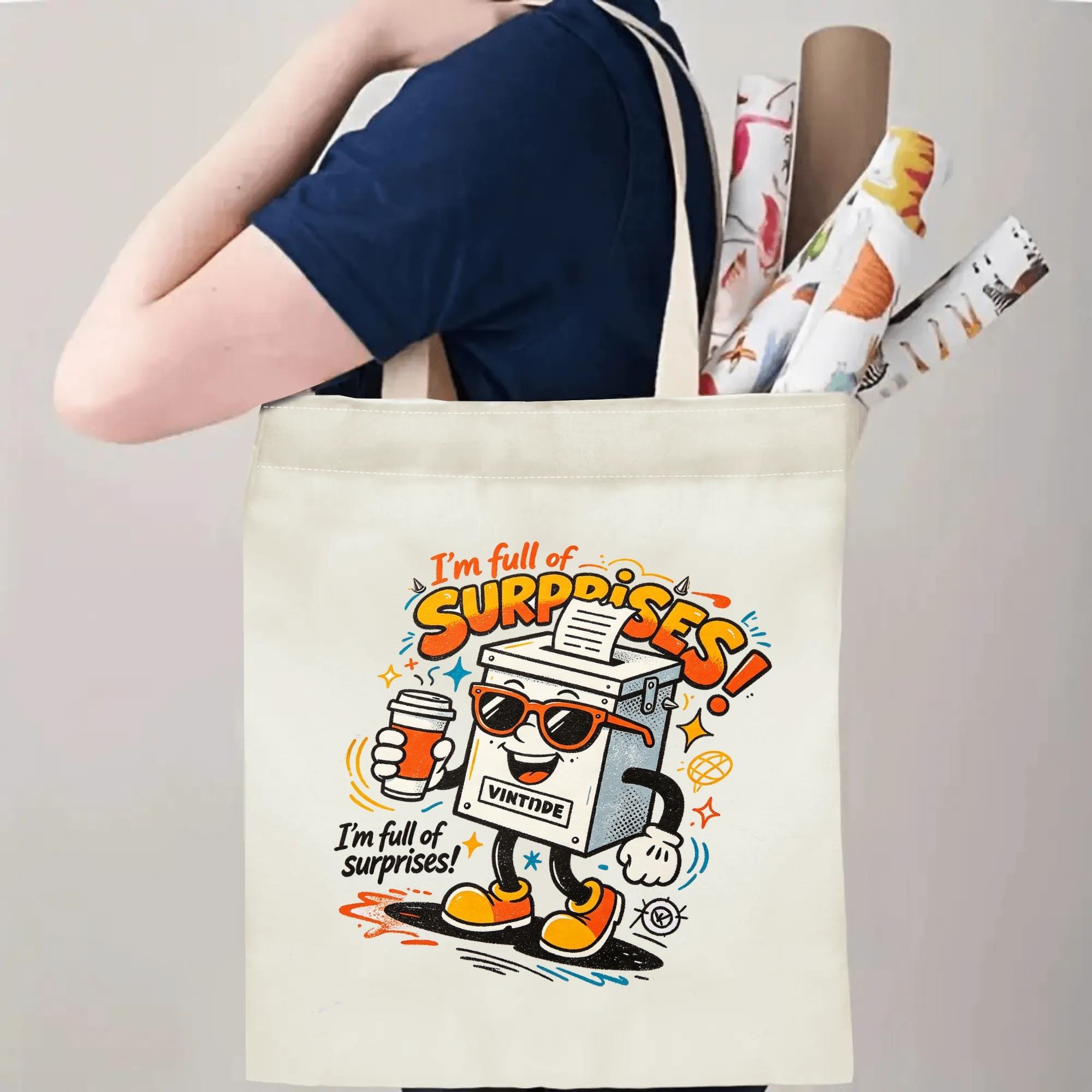 Person carrying natural canvas 2026 mid‑term election gag gift tote bag with bold colorful cartoon ballot box print and humorous "I'm full of surprises!" slogan, reusable political accessory for rallies and everyday errands