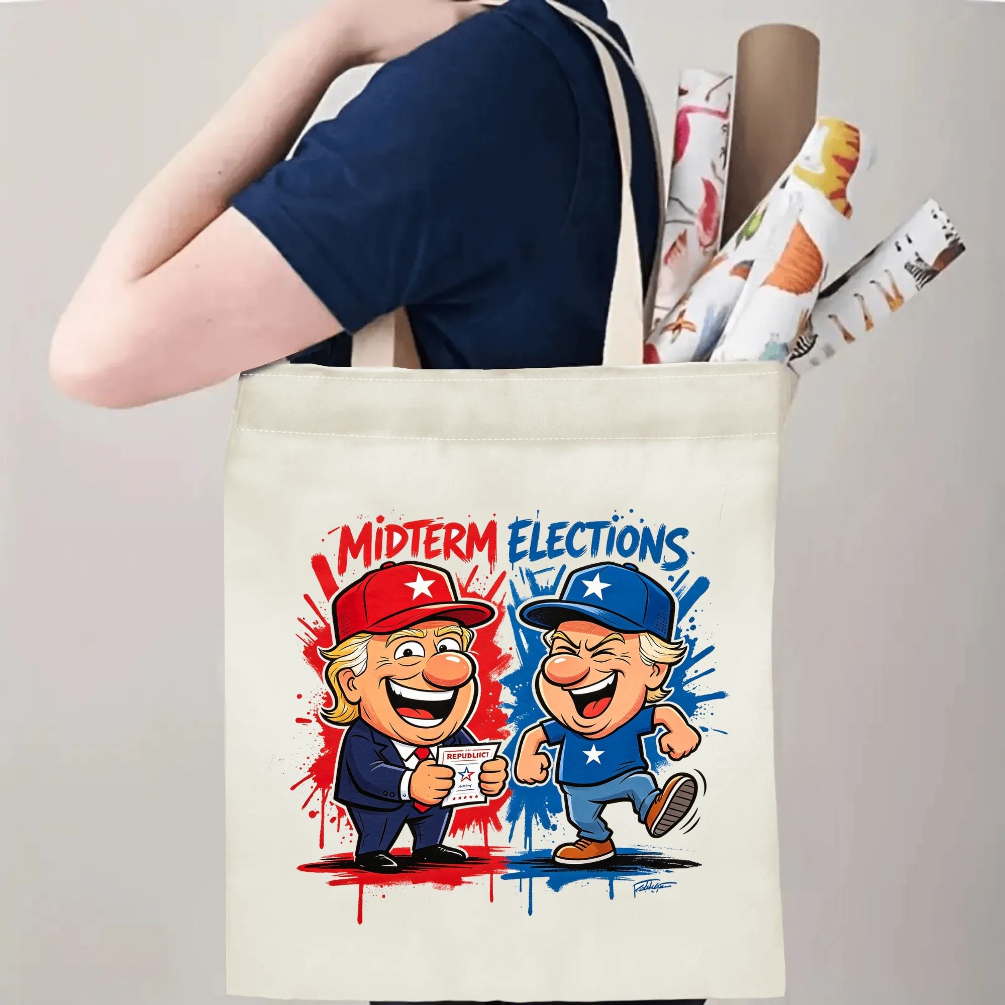 Person carrying natural canvas 2026 mid‑term election gag gift tote bag with eye‑catching cartoon political characters and patriotic splash‑art design, reusable political accessory for election rallies, voting day and everyday errands