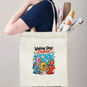 Person carrying natural canvas 2026 mid‑term election gag gift tote bag with fun chaotic cartoon character design and "Voting Day Chaos!" slogan, reusable political accessory for election rallies, voting day and everyday errands
