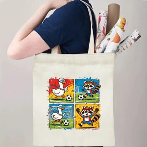 Person carrying natural canvas 2026 World Cup fan‑gift tote bag with fun street‑cartoon duck‑vs‑raccoon soccer comic design, reusable sports accessory for tournament viewing, fan events or everyday errands