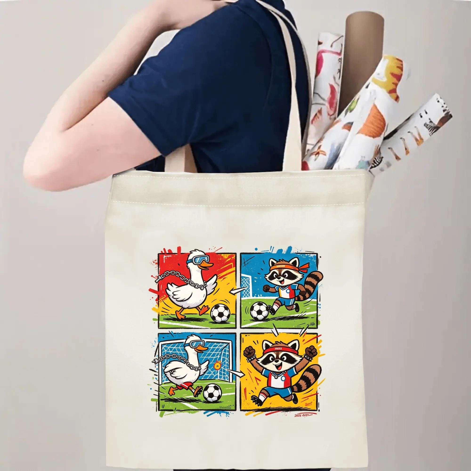 Person carrying natural canvas 2026 World Cup fan‑gift tote bag with fun street‑cartoon duck‑vs‑raccoon soccer comic design, reusable sports accessory for tournament viewing, fan events or everyday errands