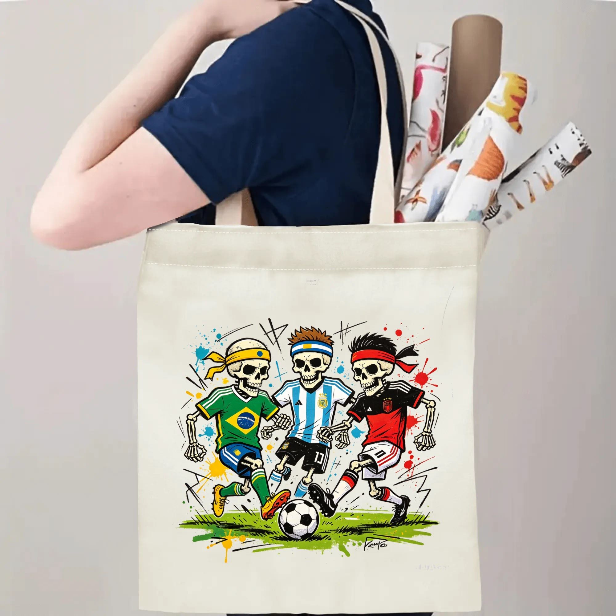 Person carrying natural canvas 2026 World Cup fan‑gift tote bag with rebellious punk‑style national‑team skeleton soccer design, reusable sports accessory for tournament viewing, fan events or everyday errands