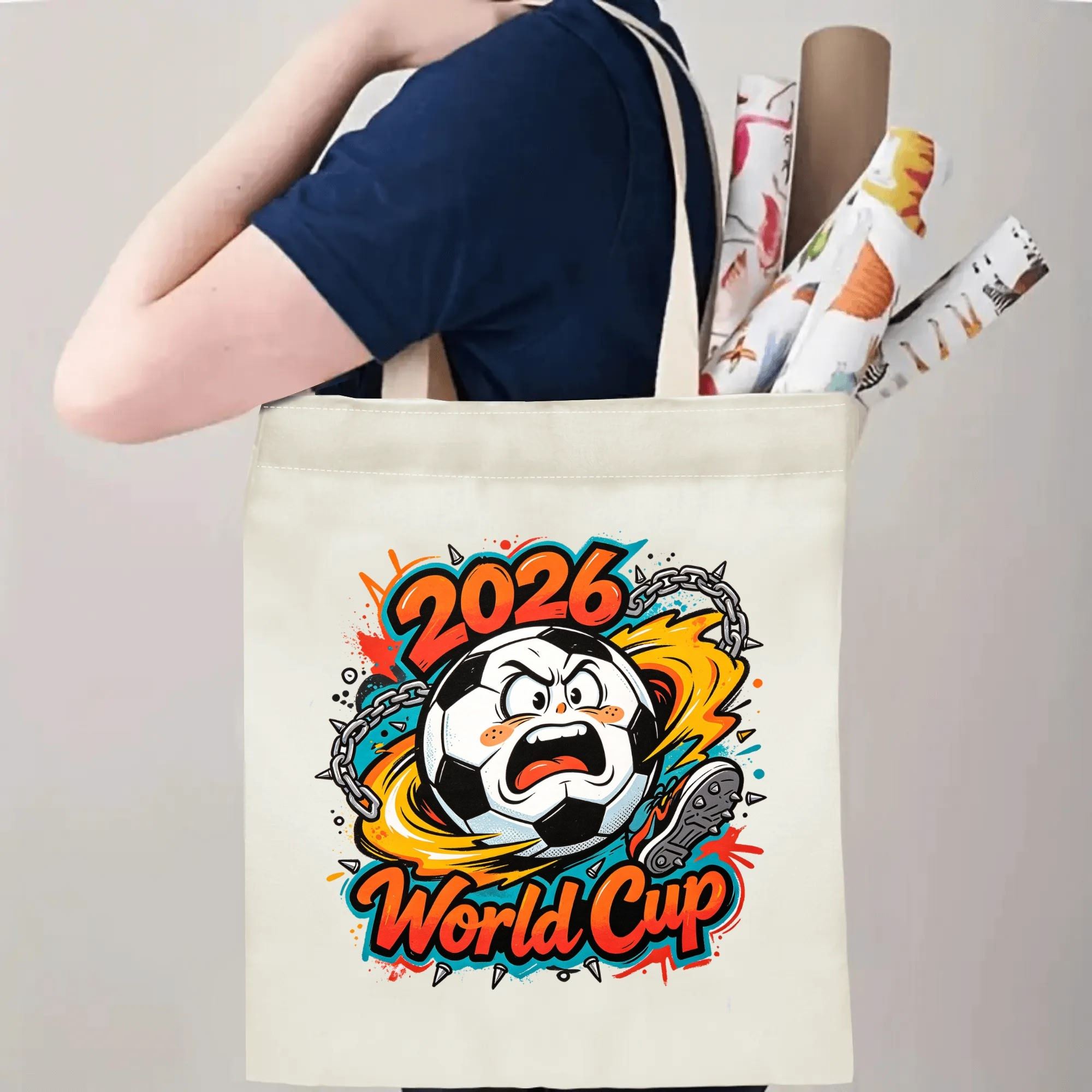 Person carrying natural canvas 2026 World Cup fan‑gift tote bag with bold rebellious punk‑cartoon soccer‑ball design, reusable sports accessory for tournament viewing, fan events or everyday errands