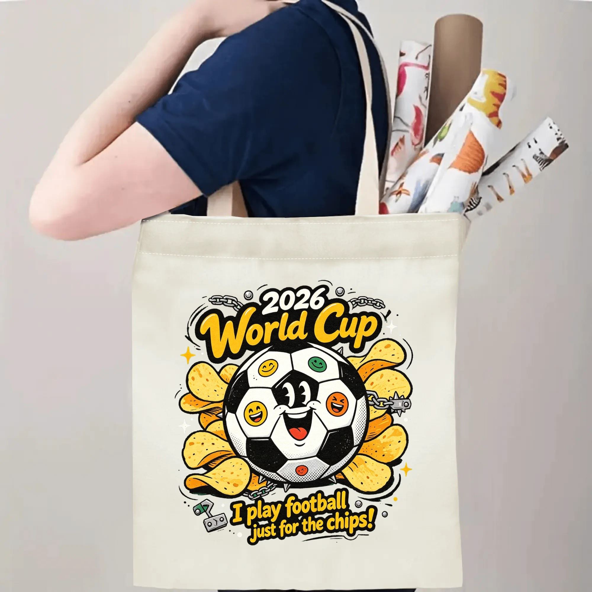 Person carrying natural canvas 2026 World Cup fan‑gift tote bag with vibrant rebellious punk‑style emoji soccer‑chips mascot design, reusable sports accessory for tournament viewing, fan events or everyday errands