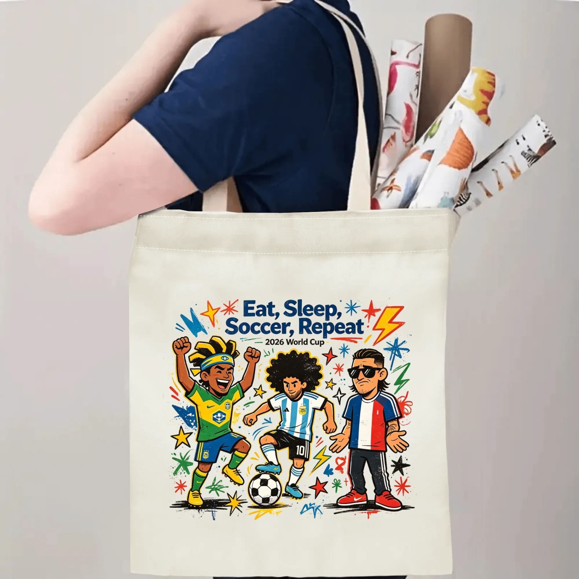 Person carrying natural canvas 2026 World Cup fan‑gift tote bag with energetic street‑cartoon soccer star celebration design, reusable sports accessory for tournament viewing, fan events or everyday errands