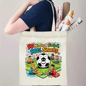 Person carrying natural canvas soccer fan‑gift tote bag with cheerful relaxed fan‑life soccer‑snack cartoon design, reusable sports accessory for match‑viewing parties, fan events or everyday errands