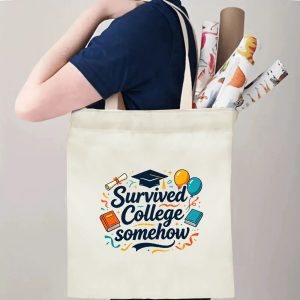 Person carrying a “Survived College Somehow” graduation tote bag over the shoulder, with rolled posters and graduation essentials.