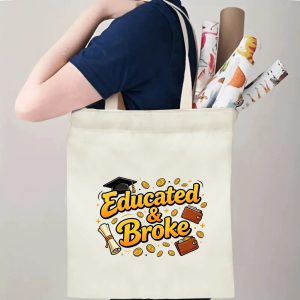 Person carrying an “Educated & Broke” graduation tote bag over the shoulder, with rolled posters and graduation essentials.