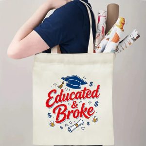 Person carrying an “Educated & Broke” graduation tote bag over the shoulder, with rolled posters and graduation essentials.