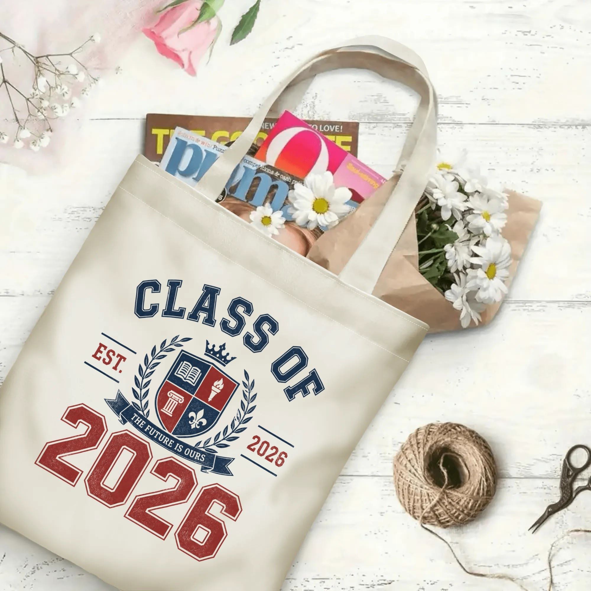 “Class of 2026” collegiate-style canvas tote bag in use, holding books, flowers, and gifts.