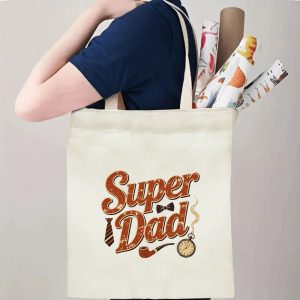 Person carrying a “Super Dad” Father’s Day tote bag over the shoulder, perfect for classic dad outings and errands.