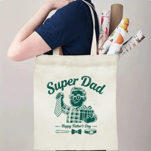 Person carrying a “Super Dad” Father’s Day tote bag over the shoulder, perfect for celebrating dad’s playful and hardworking spirit.