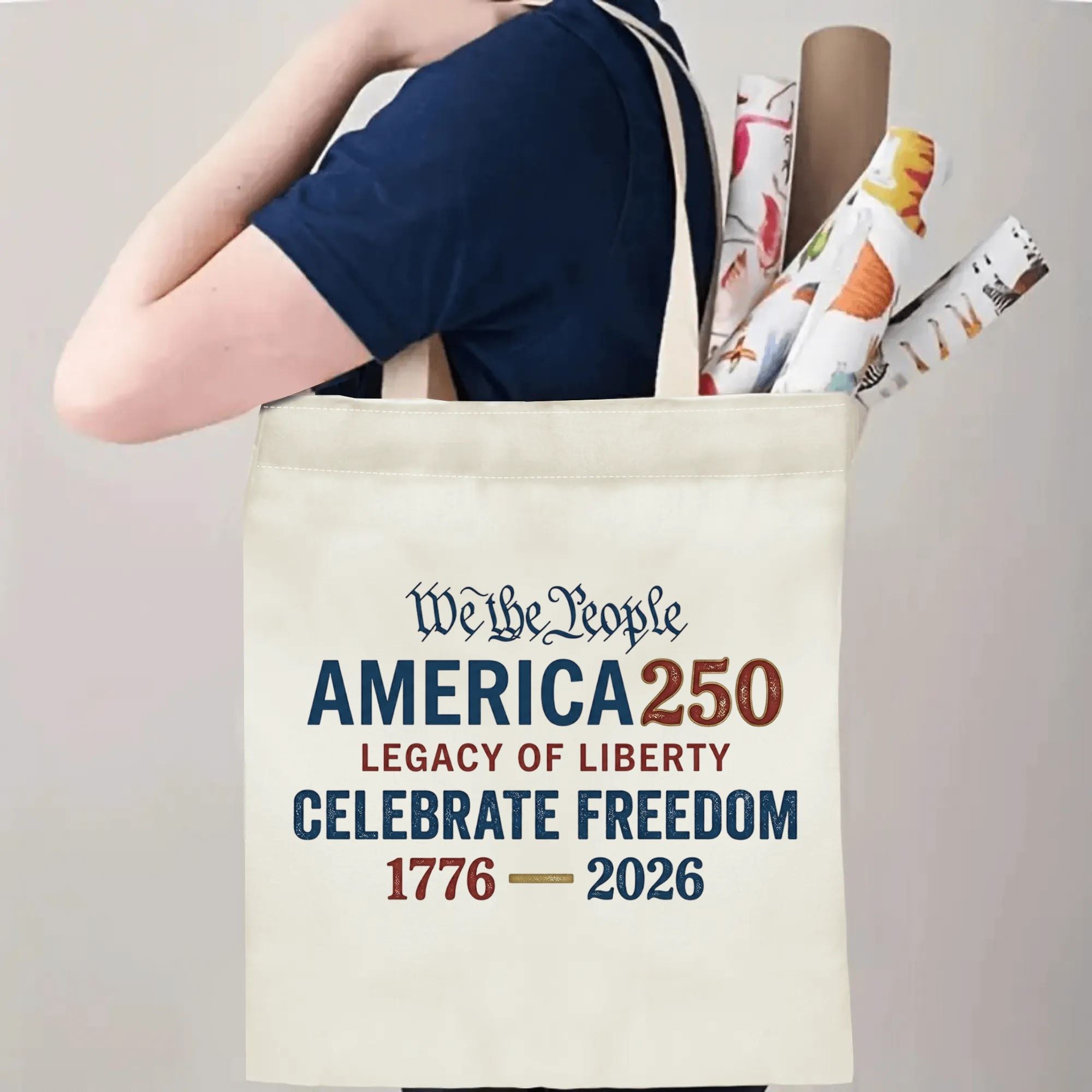 "America 250" tote bag being carried by a person, demonstrating its comfortable straps and capacity for daily essentials or event items.