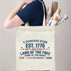 "E Pluribus Unum" tote bag being carried by a person, demonstrating its comfortable straps and capacity for daily essentials or event items.