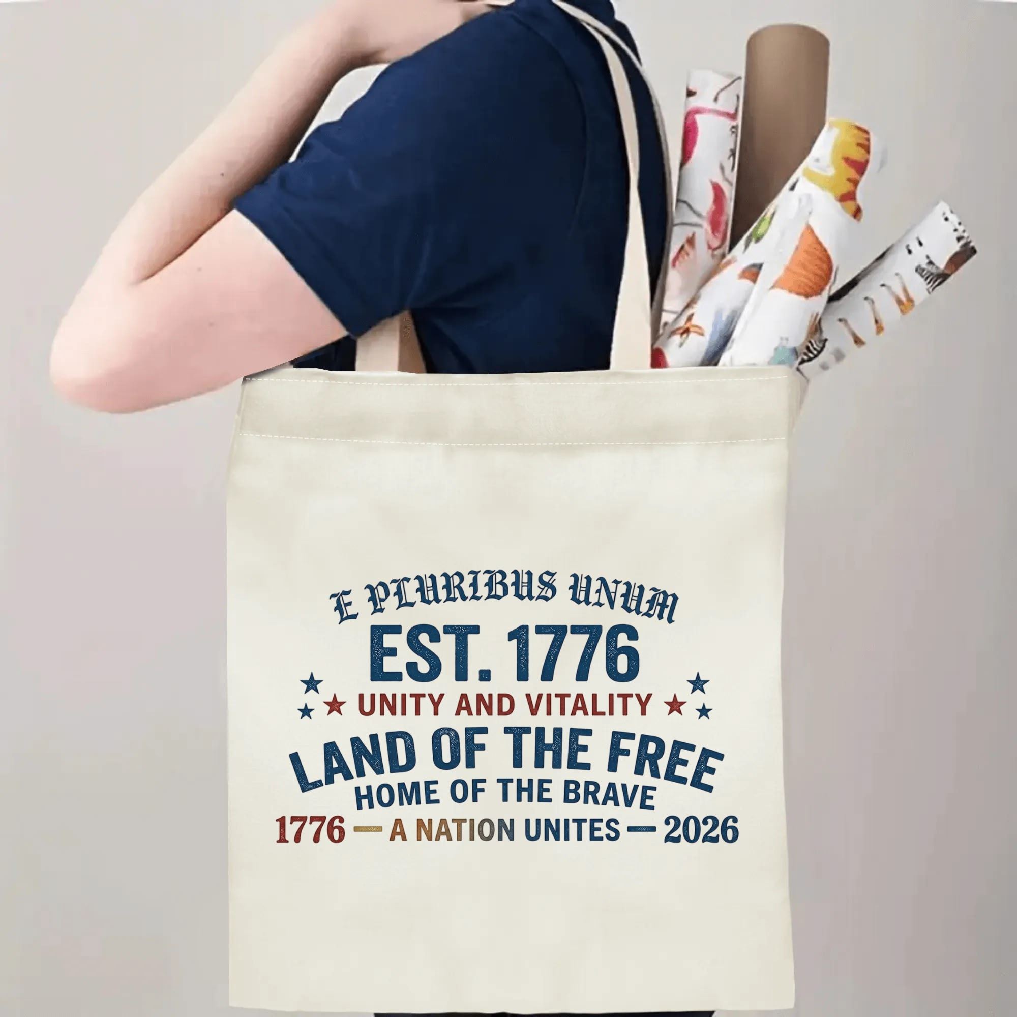 "E Pluribus Unum" tote bag being carried by a person, demonstrating its comfortable straps and capacity for daily essentials or event items.