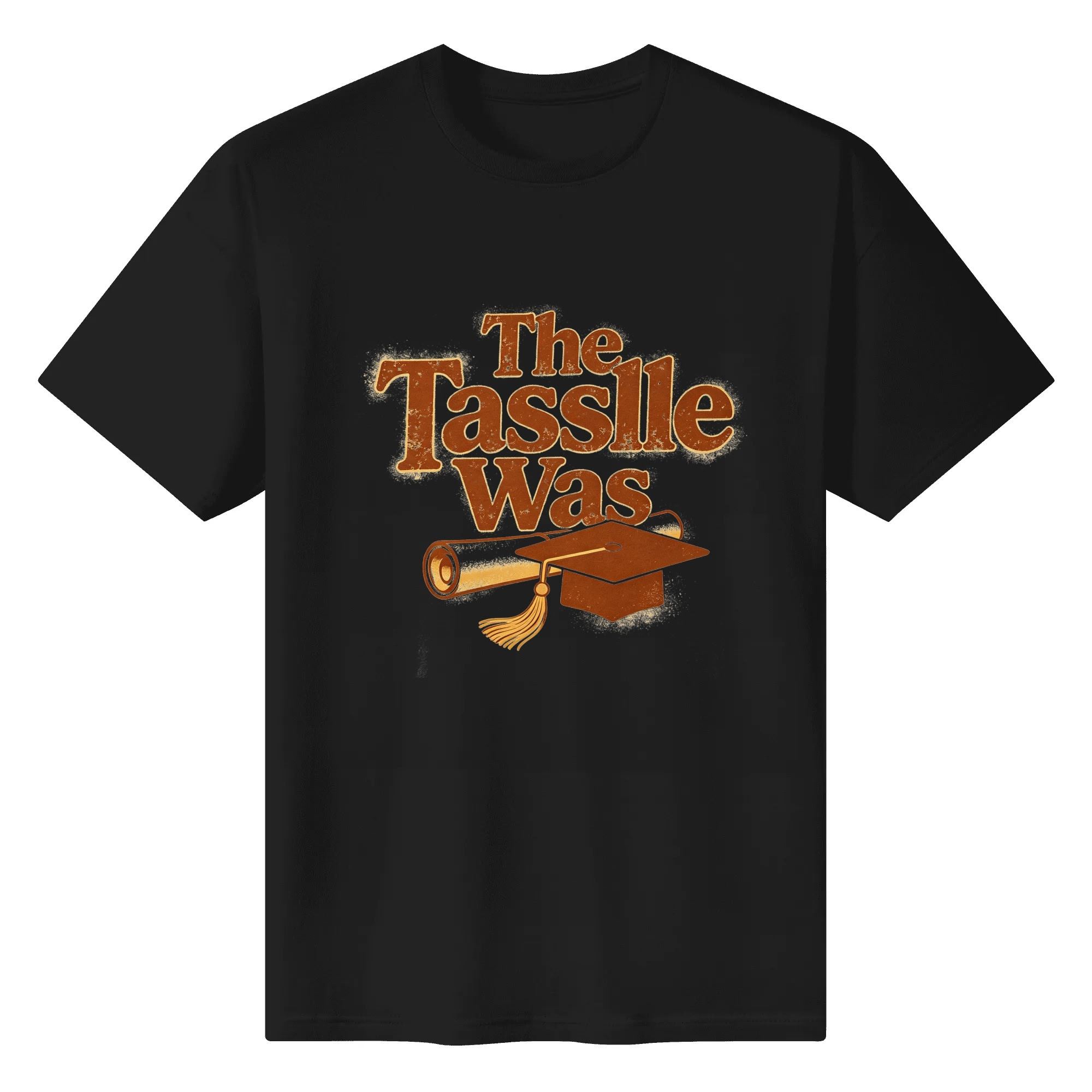 Black crewneck T-shirt with a retro-style “The Tassle Was” graphic, featuring distressed brown lettering, a graduation cap, and diploma.
