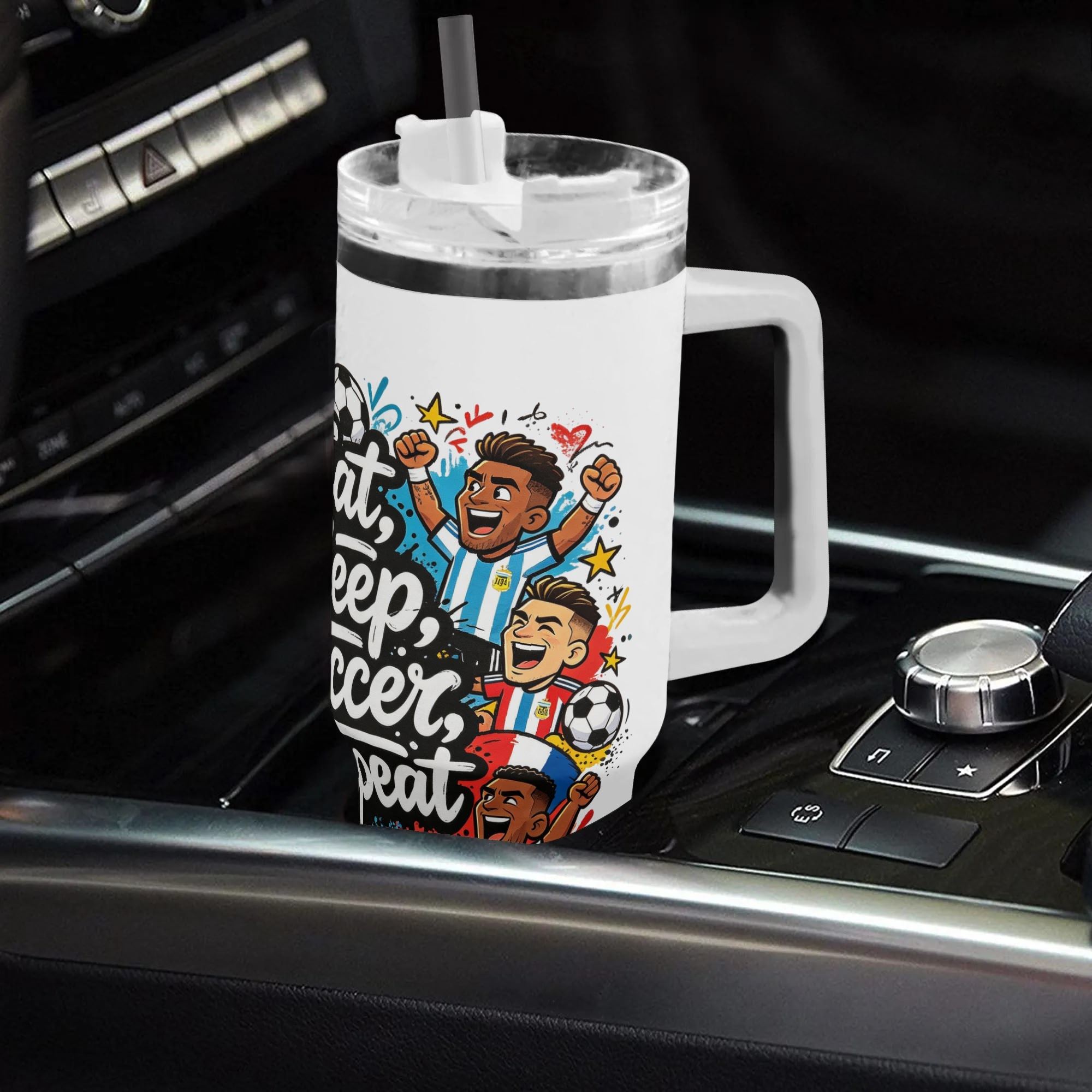 40oz lively soccer‑lifestyle themed insulated tumbler with handle placed on car center console, fun national‑team cartoon footballer graphic with "Eat Sleep Soccer Repeat" typography, leak‑proof straw lid, auto‑safe hot‑cold drink cup
